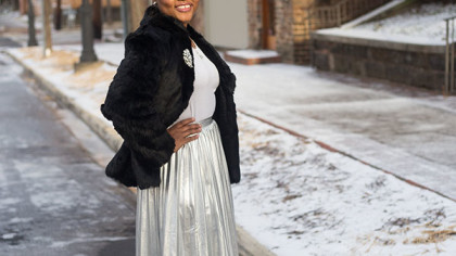 fur coat and metallic pleated skirt